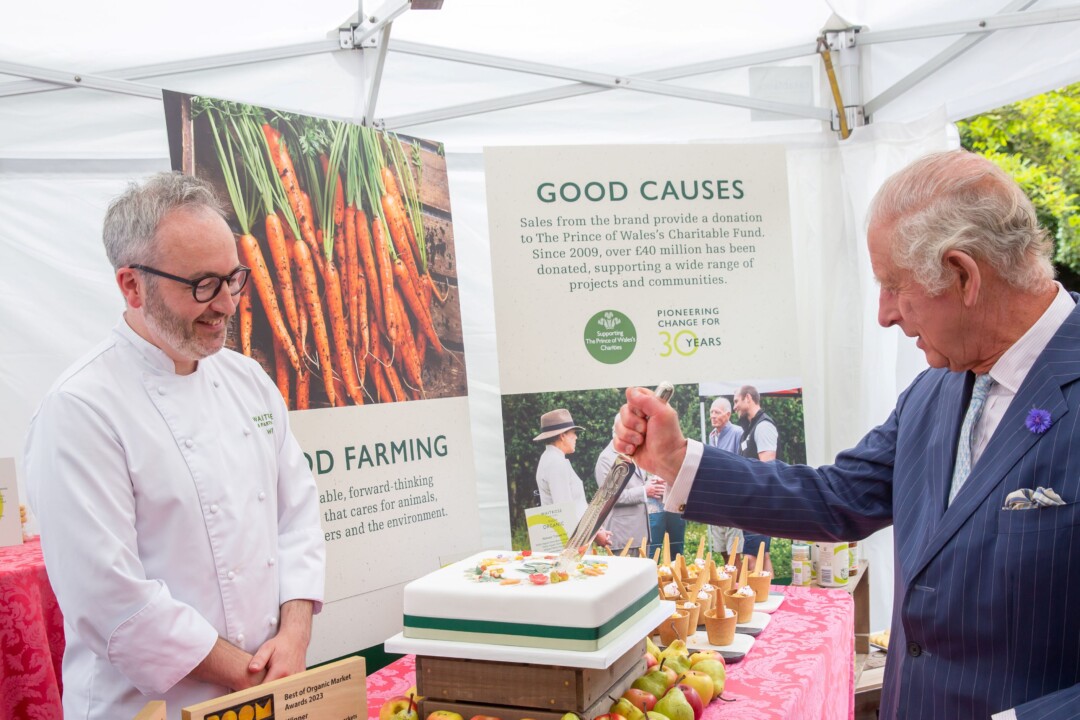 King Charles III cuts cake